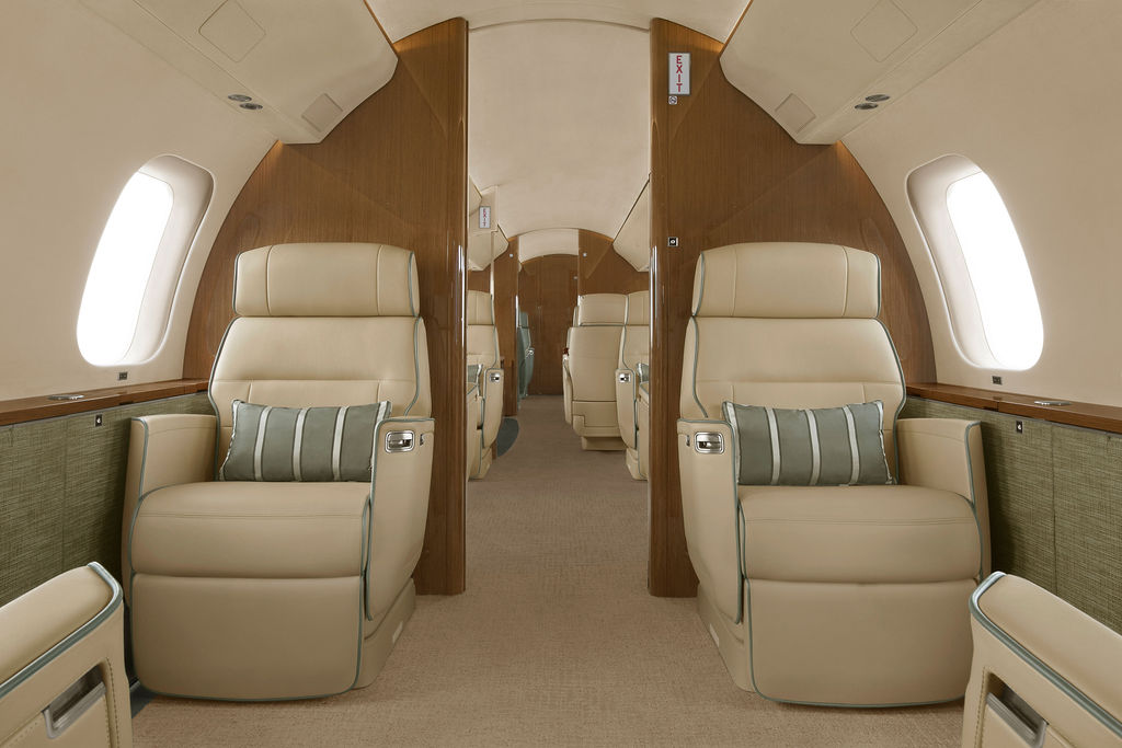 Spacious Global 7500 cabin interior with leather club seats and walnut veneer